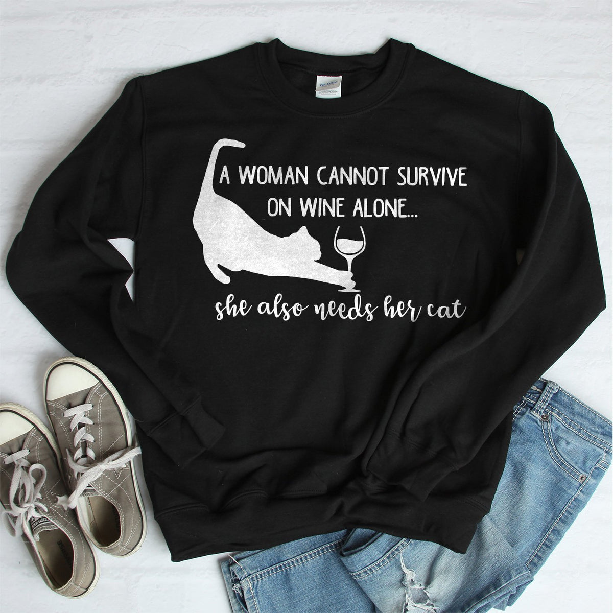 A Woman Cannot Survive on Wine Alone, She also Needs her Cat - Long Sleeve Heavy Crewneck Sweatshirt