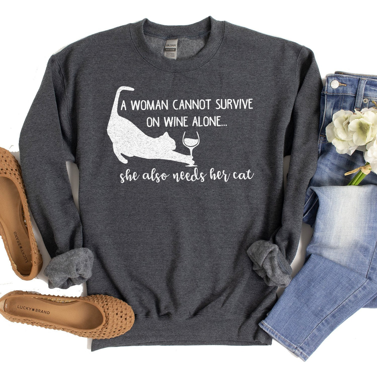 A Woman Cannot Survive on Wine Alone, She also Needs her Cat - Long Sleeve Heavy Crewneck Sweatshirt