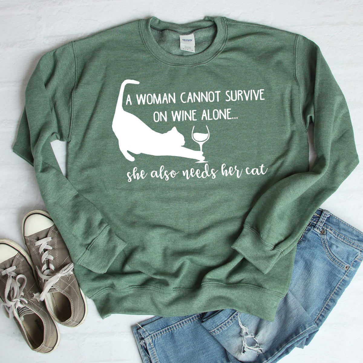 A Woman Cannot Survive on Wine Alone, She also Needs her Cat - Long Sleeve Heavy Crewneck Sweatshirt