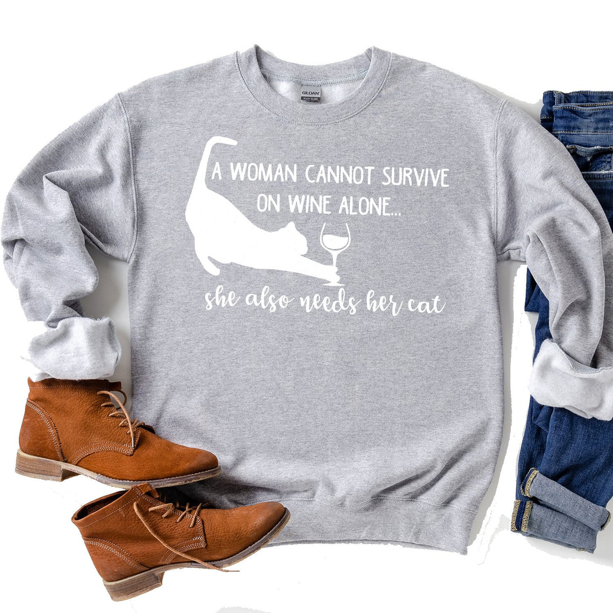 A Woman Cannot Survive on Wine Alone, She also Needs her Cat - Long Sleeve Heavy Crewneck Sweatshirt