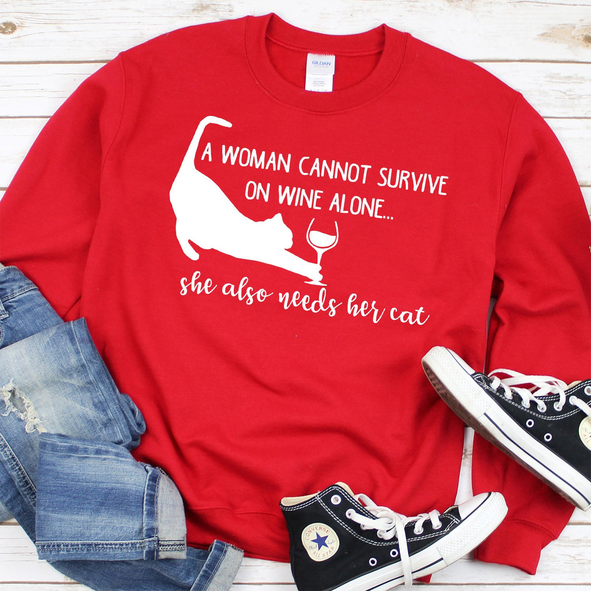 A Woman Cannot Survive on Wine Alone, She also Needs her Cat - Long Sleeve Heavy Crewneck Sweatshirt