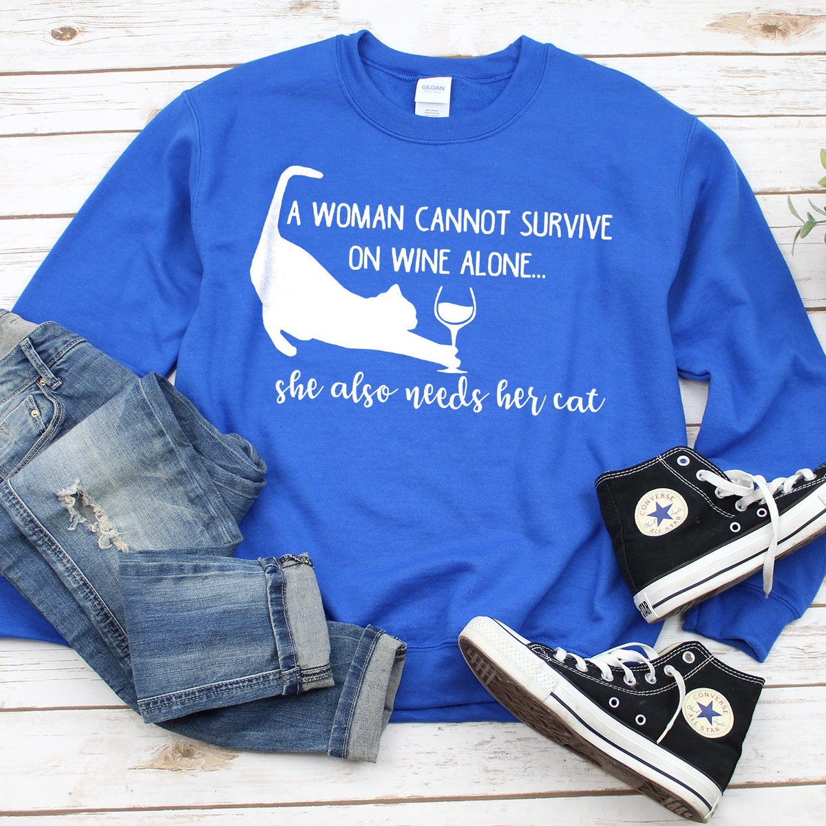 A Woman Cannot Survive on Wine Alone, She also Needs her Cat - Long Sleeve Heavy Crewneck Sweatshirt