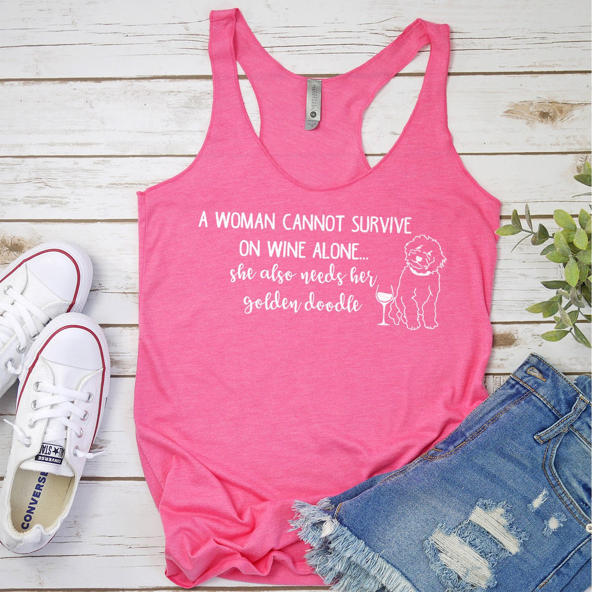 A Woman Cannot Survive on Wine Alone, She also Needs her Golden Doodle - Tank Top Racerback