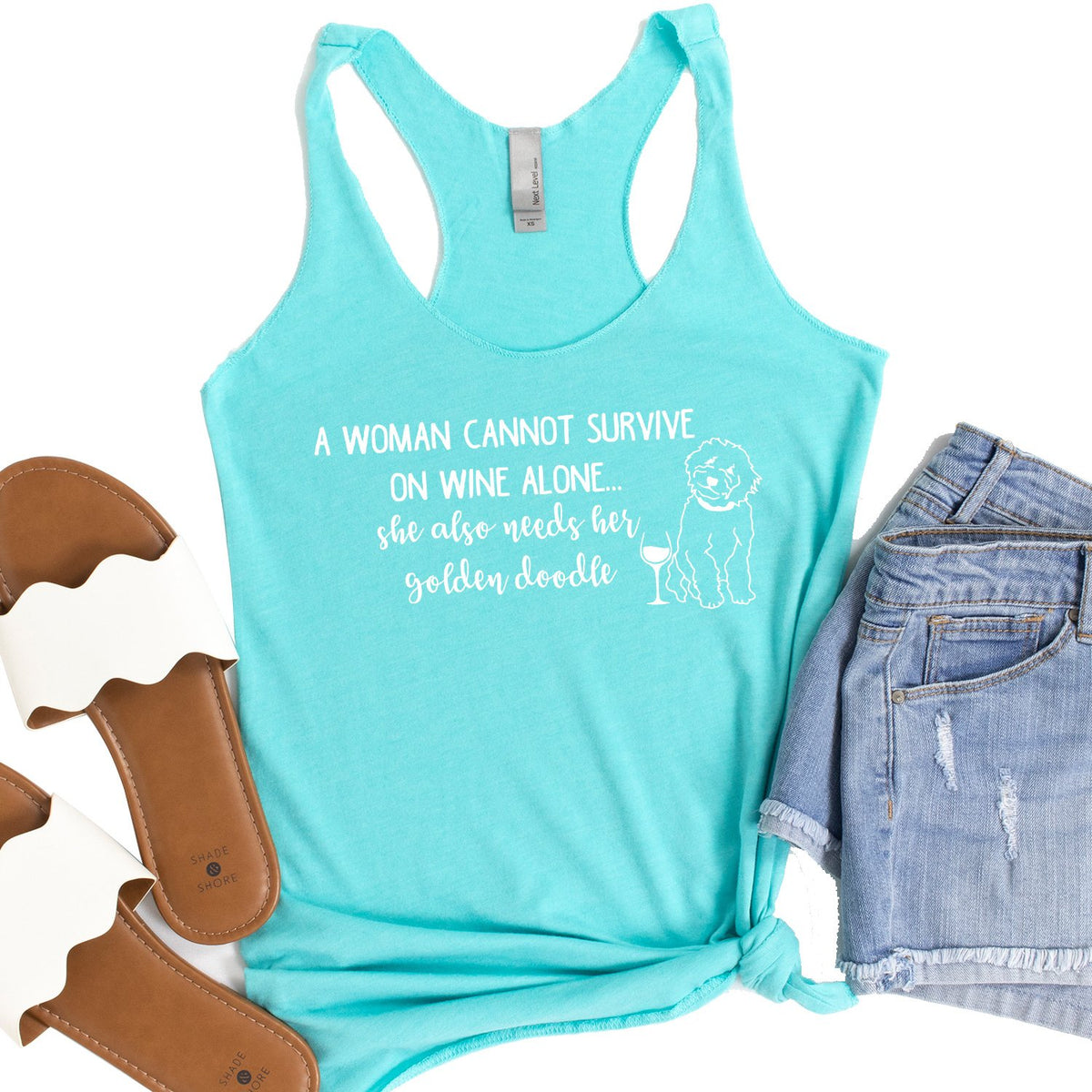 A Woman Cannot Survive on Wine Alone, She also Needs her Golden Doodle - Tank Top Racerback